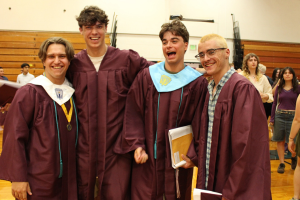  boys in graduation gowns